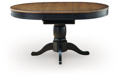 Clorazi - Oval Dining Room Butterfly Extension Table - Black / Brown