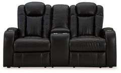 Caveman Den - Power Reclining Loveseat with Console/ Adj Hdrst - Midnight
